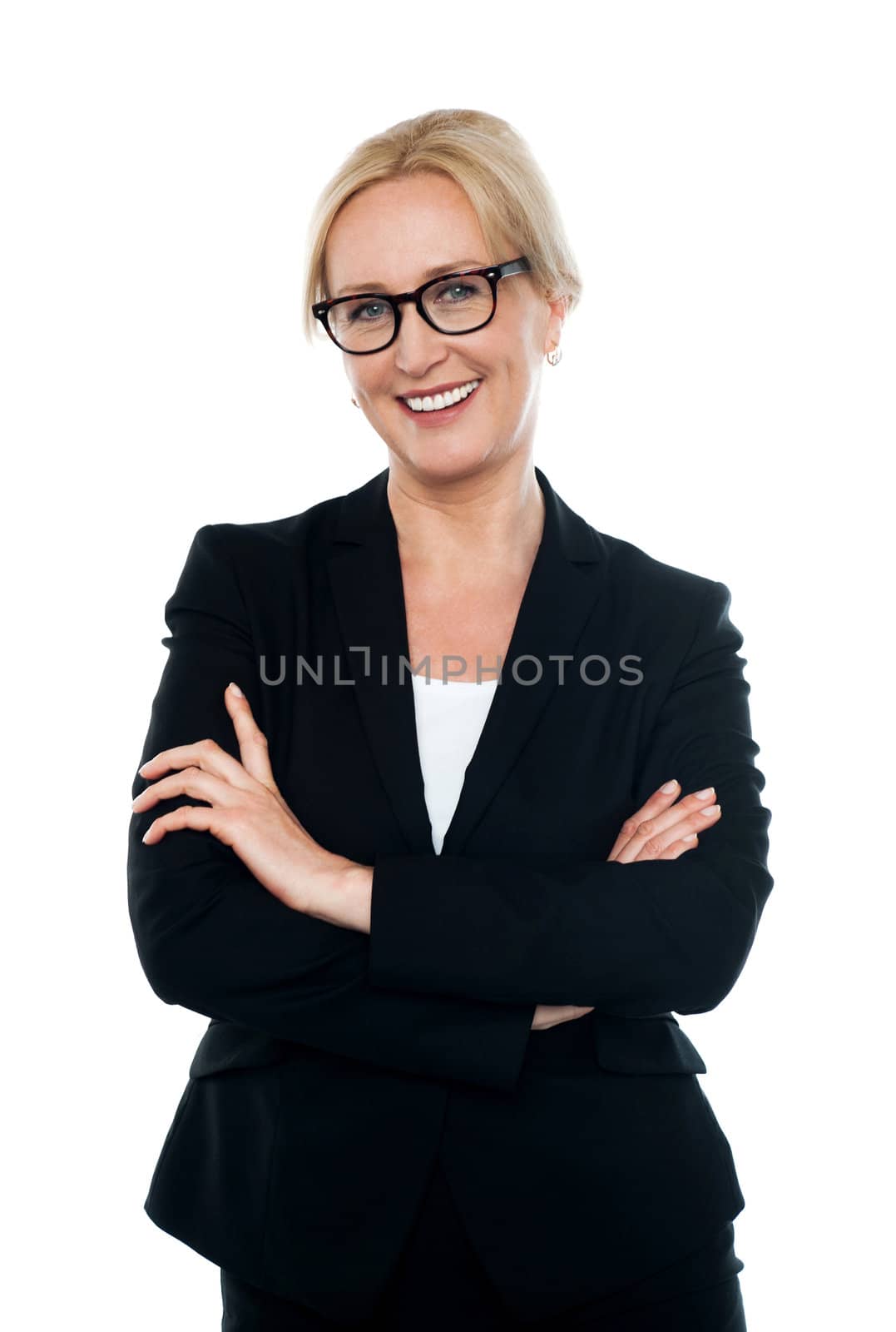 Confident female executive wearing eyeglasses, posing with arms crossed