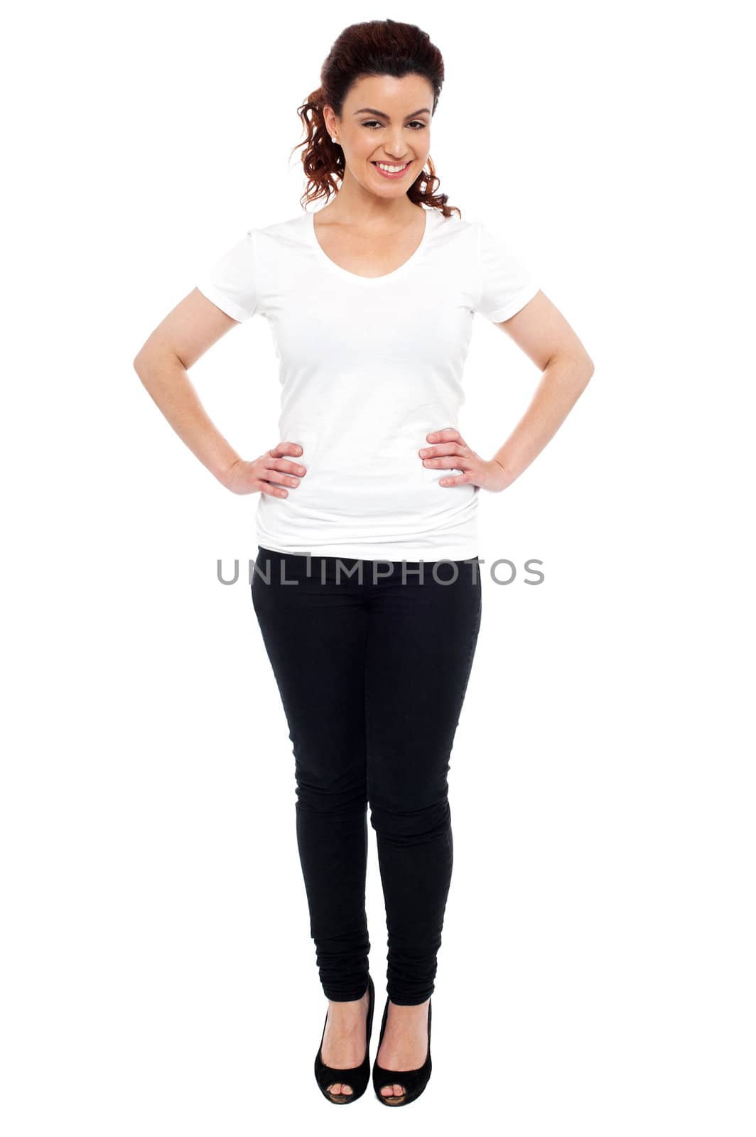 Full portrait of gorgeous brunette standing with hands on her waist
