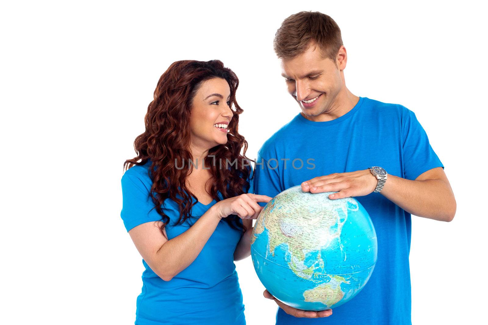 Couple discussing about specific country while points at it. All on white background