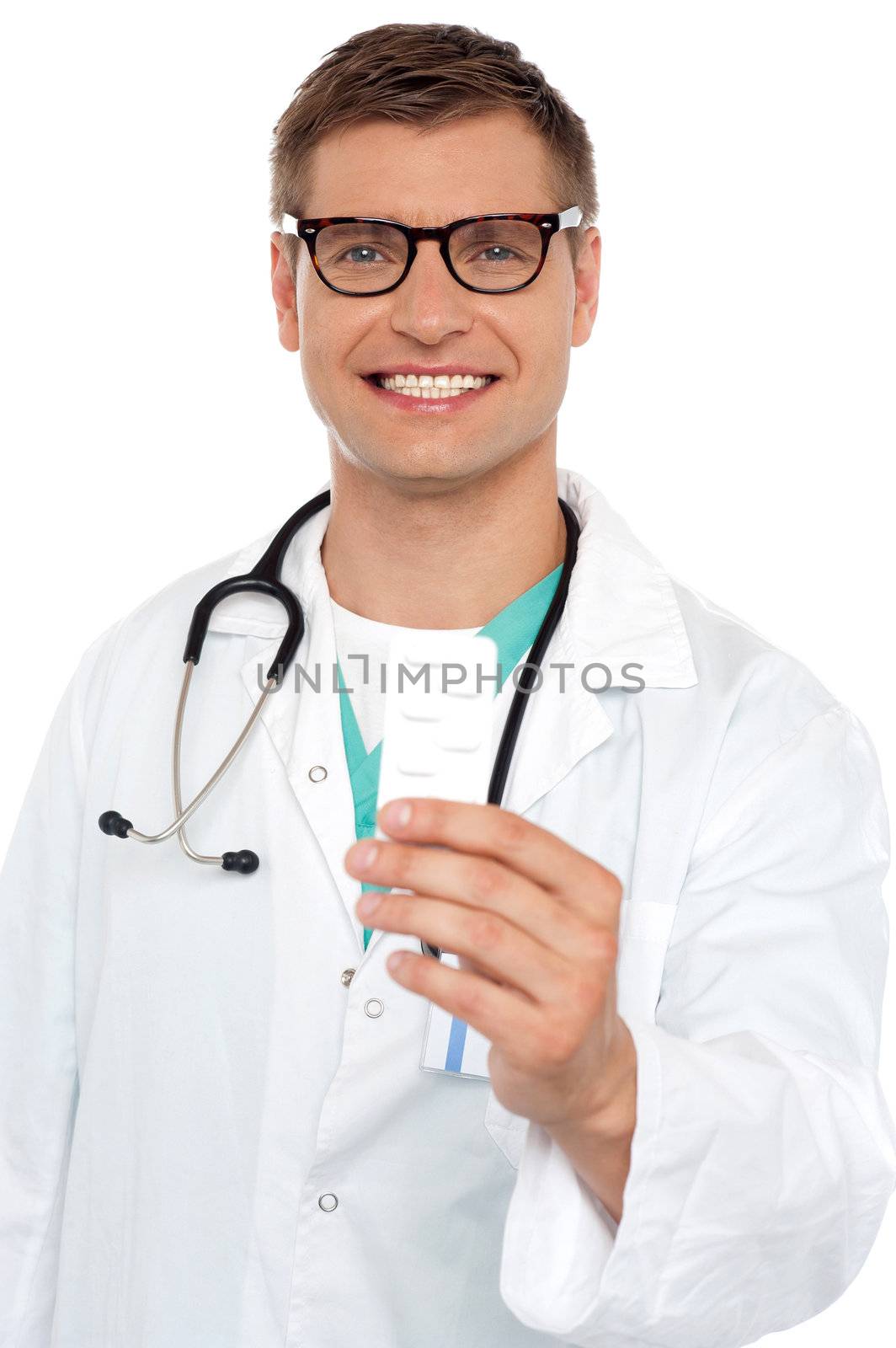 Portrait of a young doctor with medicines in hand smiling at camera