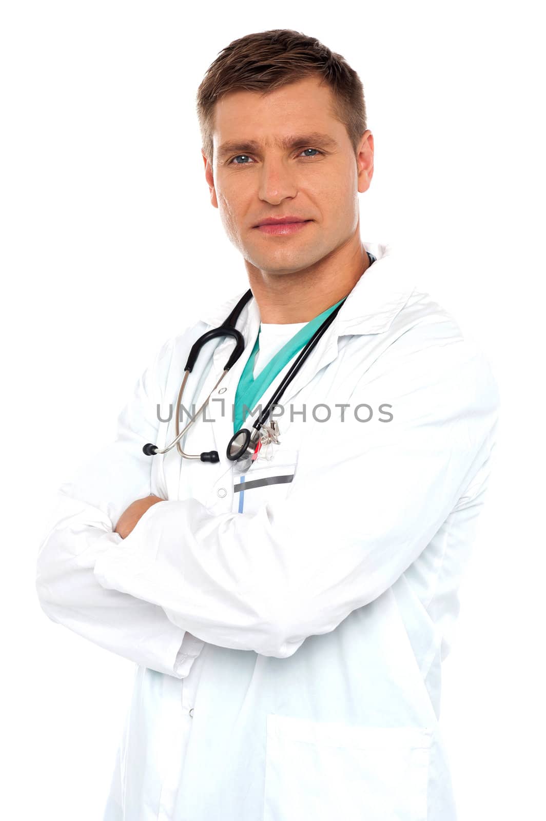 Handsome young doctor posing with crossed arms against white background