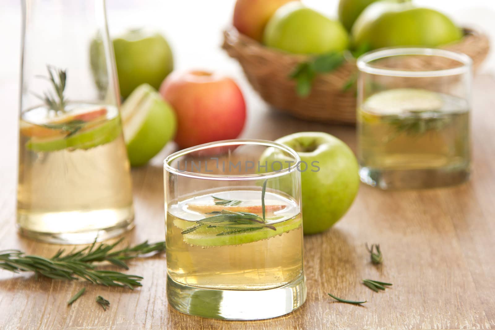 Apple juice with apple slices and rosemary