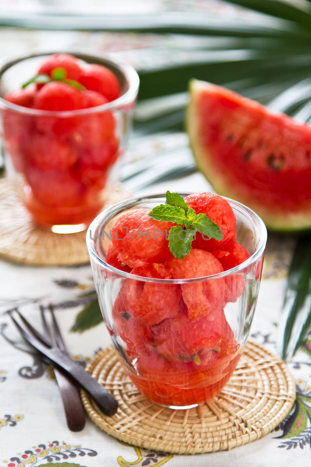 Watermelon scoop in glasses with mint