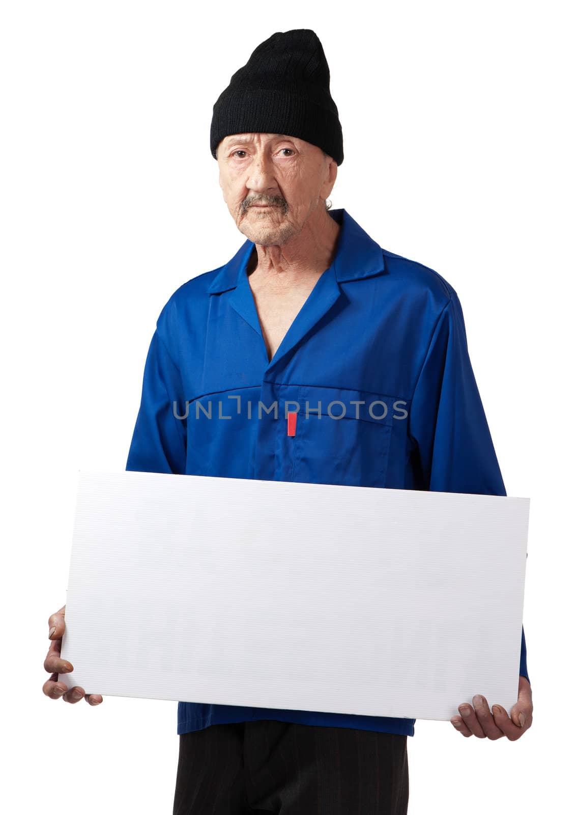A serious senior worker displays a blank poster.