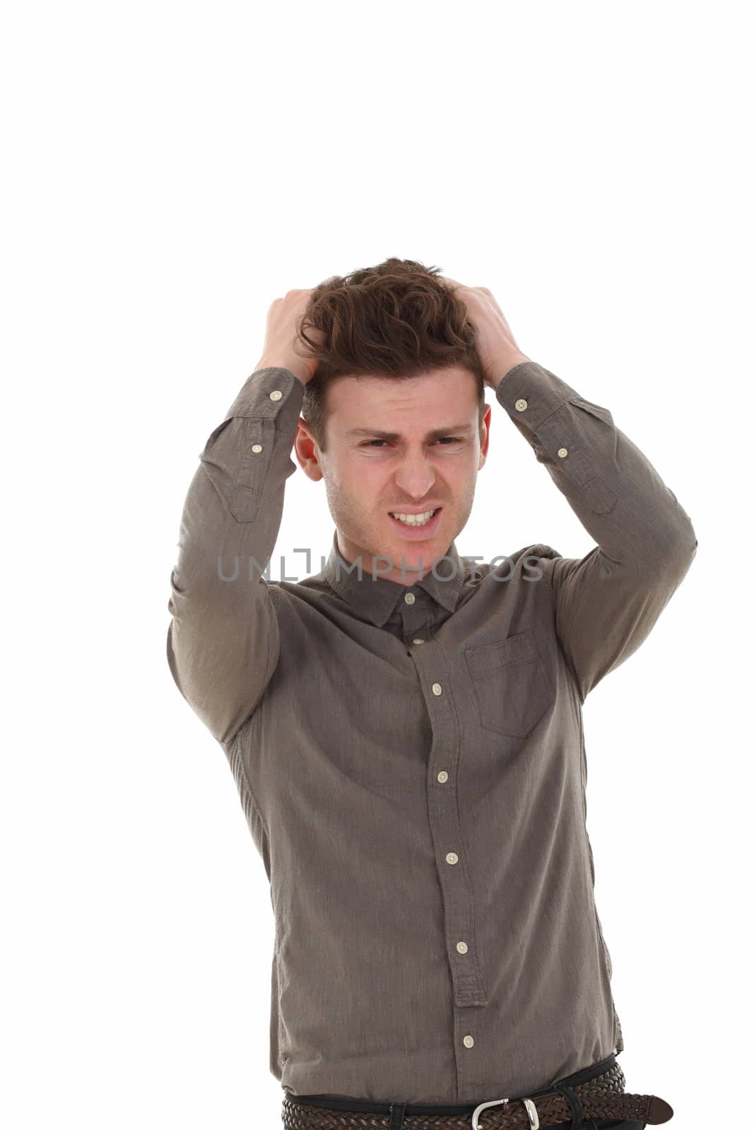 A young adult male with hands in the hair