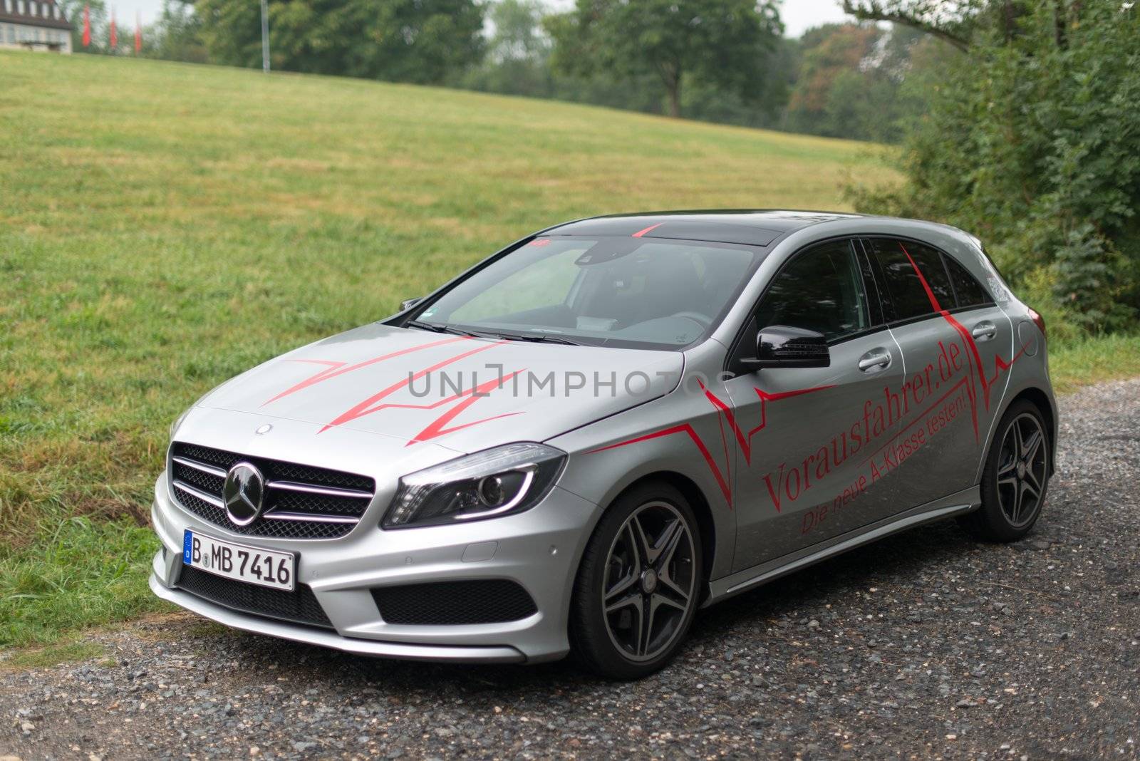 STUTTGART – SEPTEMBER 1: A Mercedes Benz A-Class car during a test drive in front of Solitude Castle on September 1, 2012 in Stuttgart, Germany. A few weeks before the official availability of the new A-Class Mercedes is touring through various European Cities where the public can test drive the car already.