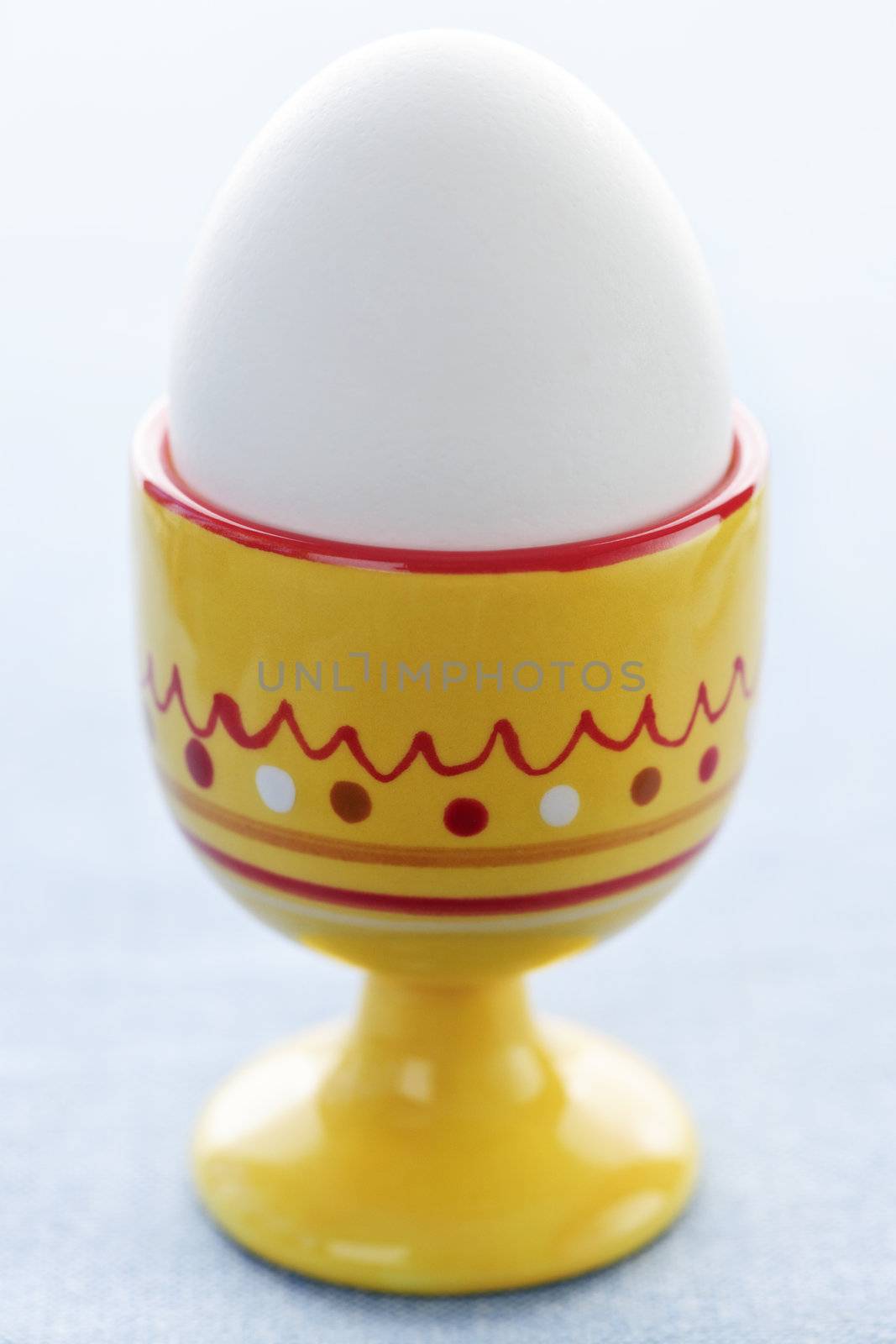 Closeup of soft boiled egg in cup