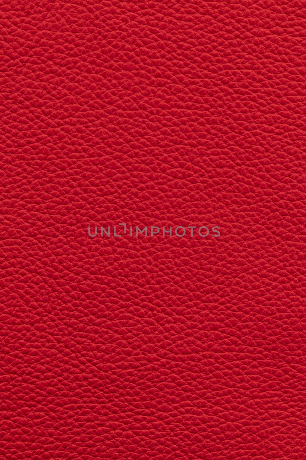 Red natural leather background or texture close up