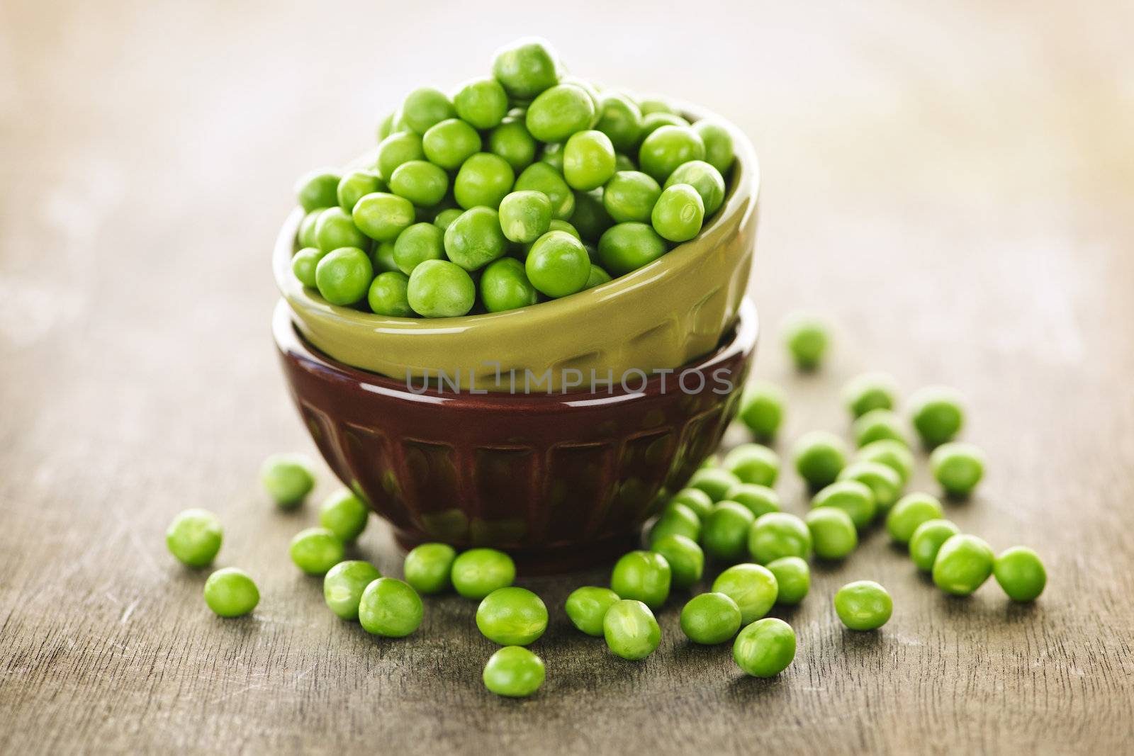 Bowl full of fresh green organic green peas