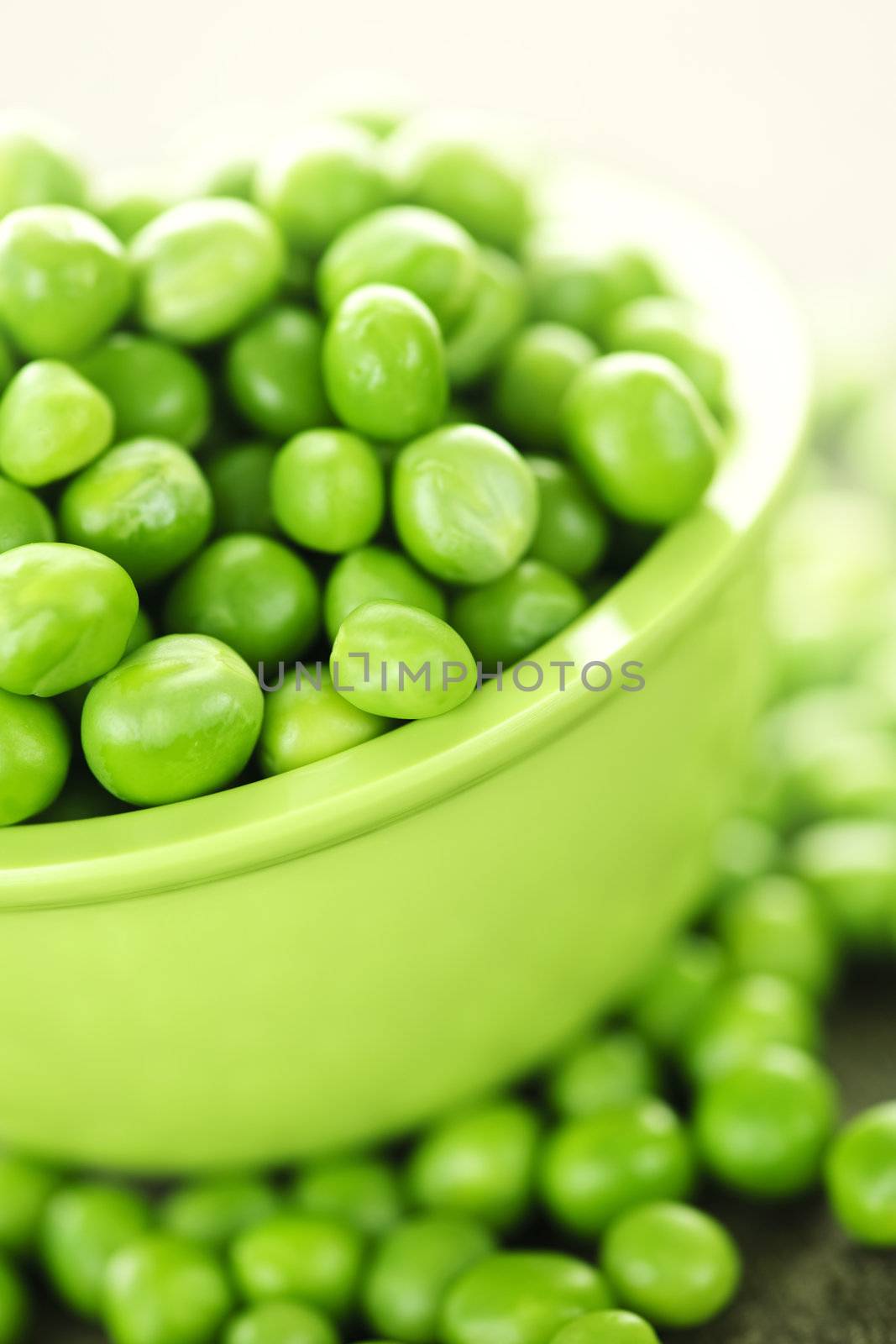 Bowl of green peas by elenathewise