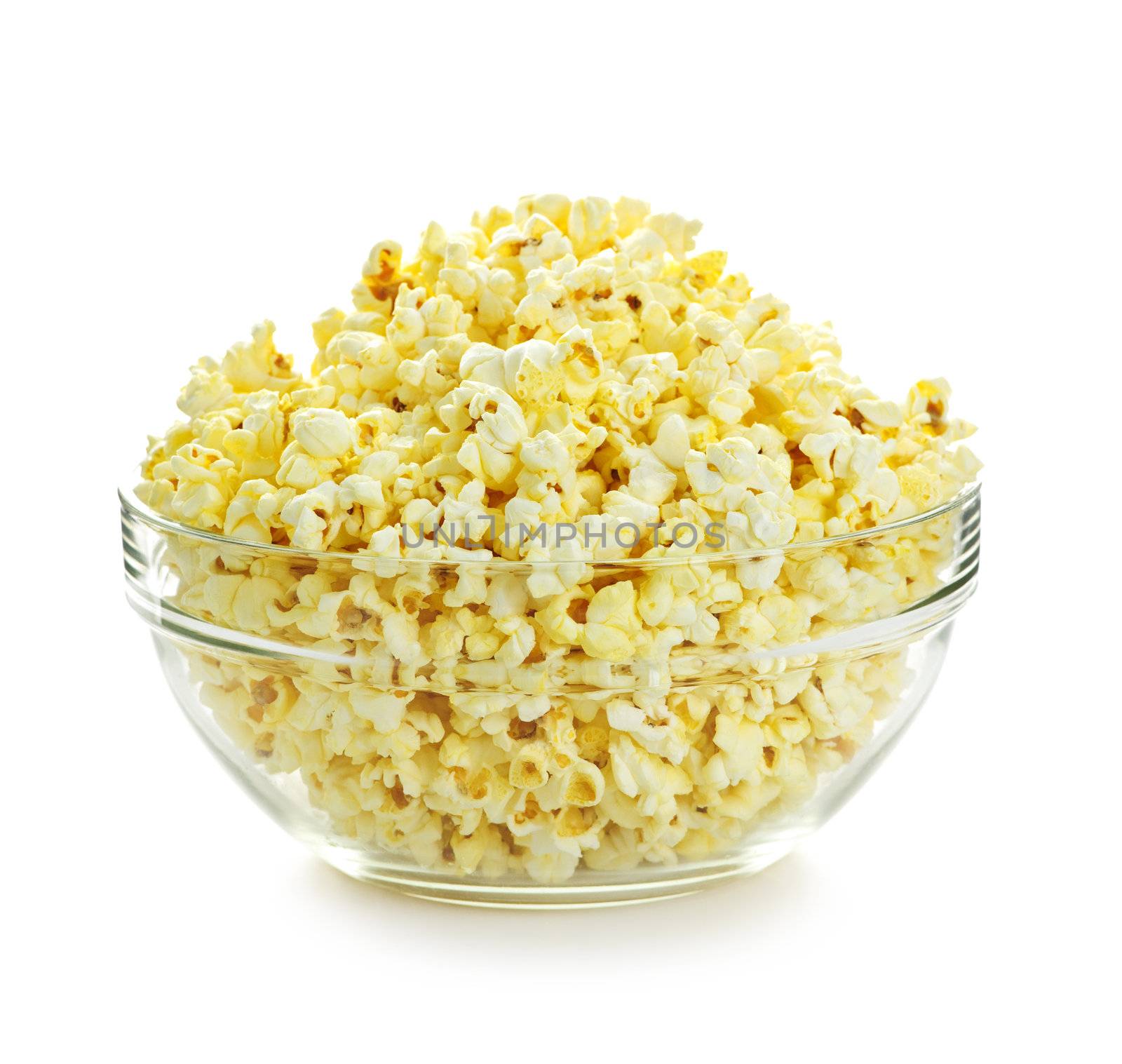 Bowl of fresh popped popcorn isolated on white background