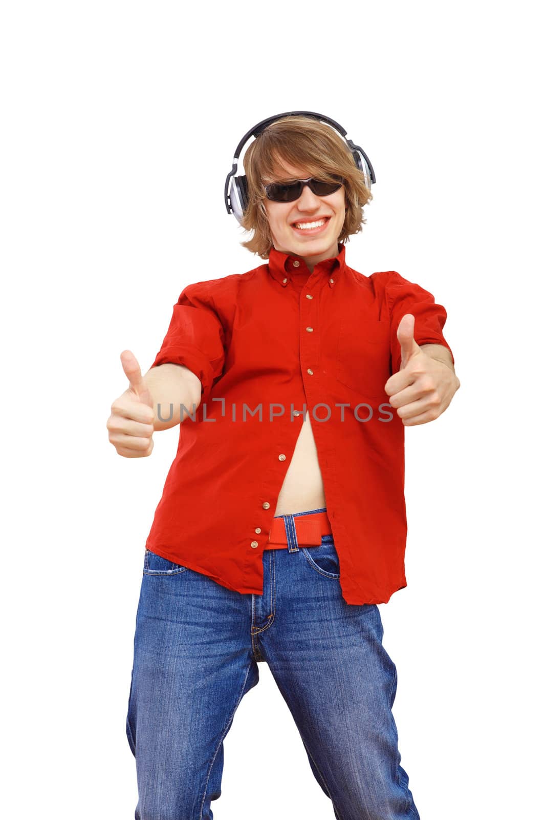 Happy smiling young man dancing and listening to music