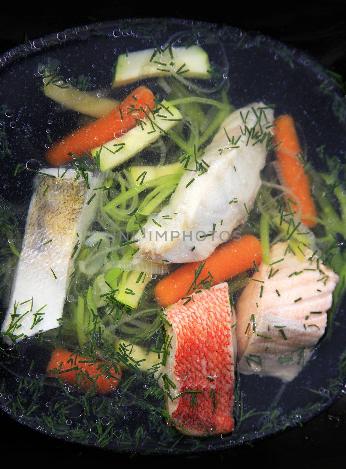 Tasty soup of a fish with vegetable marrows and carrots