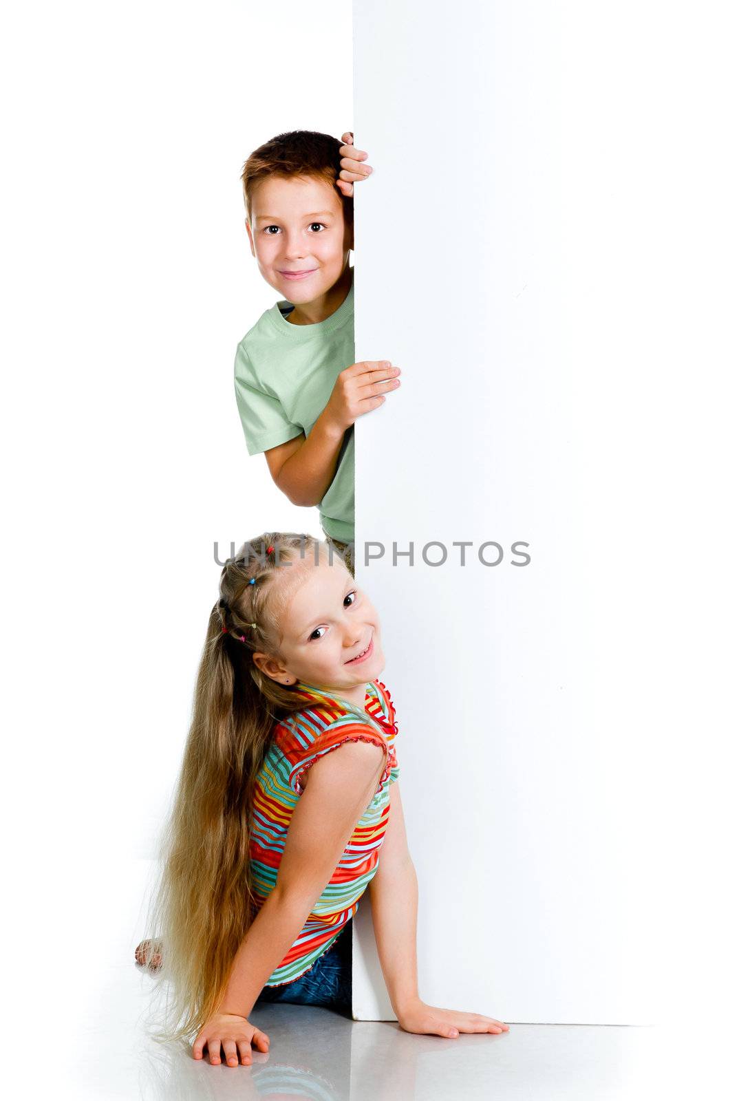 smiling kids with white board