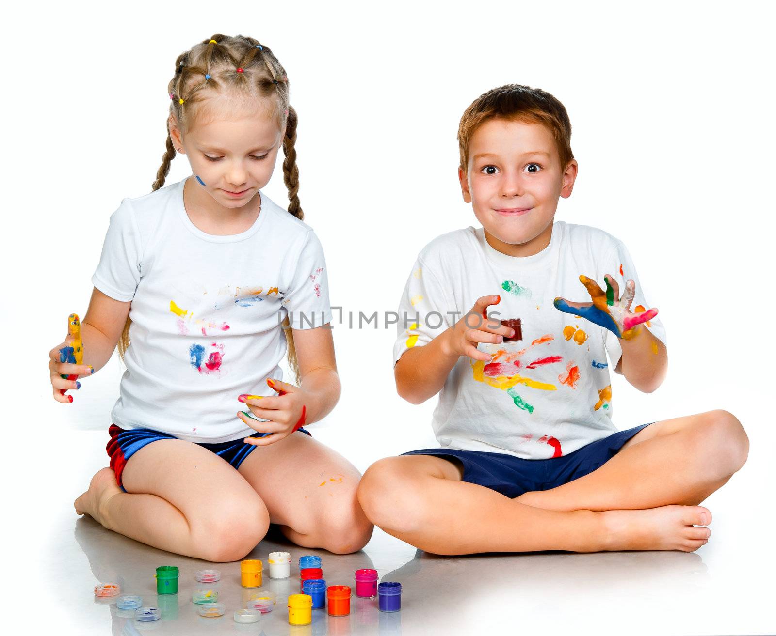 kids with hands in paint  on a white background