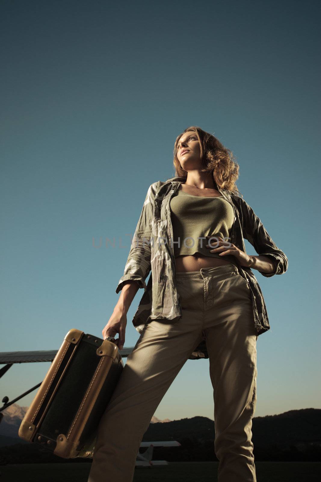 Fashion young woman with a suitcase