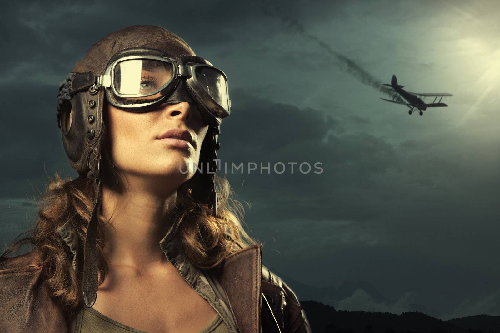 Portrait of young woman airplane pilot