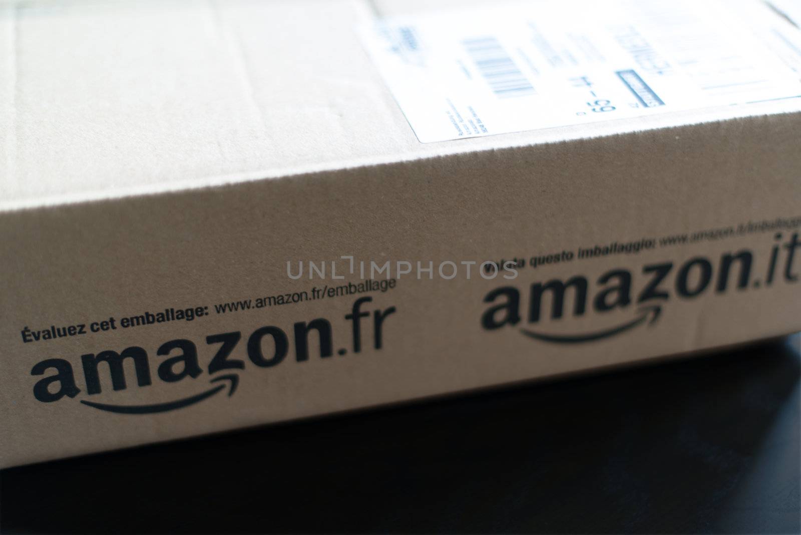 STUTTGART - SEPTEMBER 2: An Amazon.com parcel waiting on a table in a flat for being unpacked on September 2, 2012 in Stuttgart, Germany. Amazon.com is delivering thousands of parcels every day to German households.