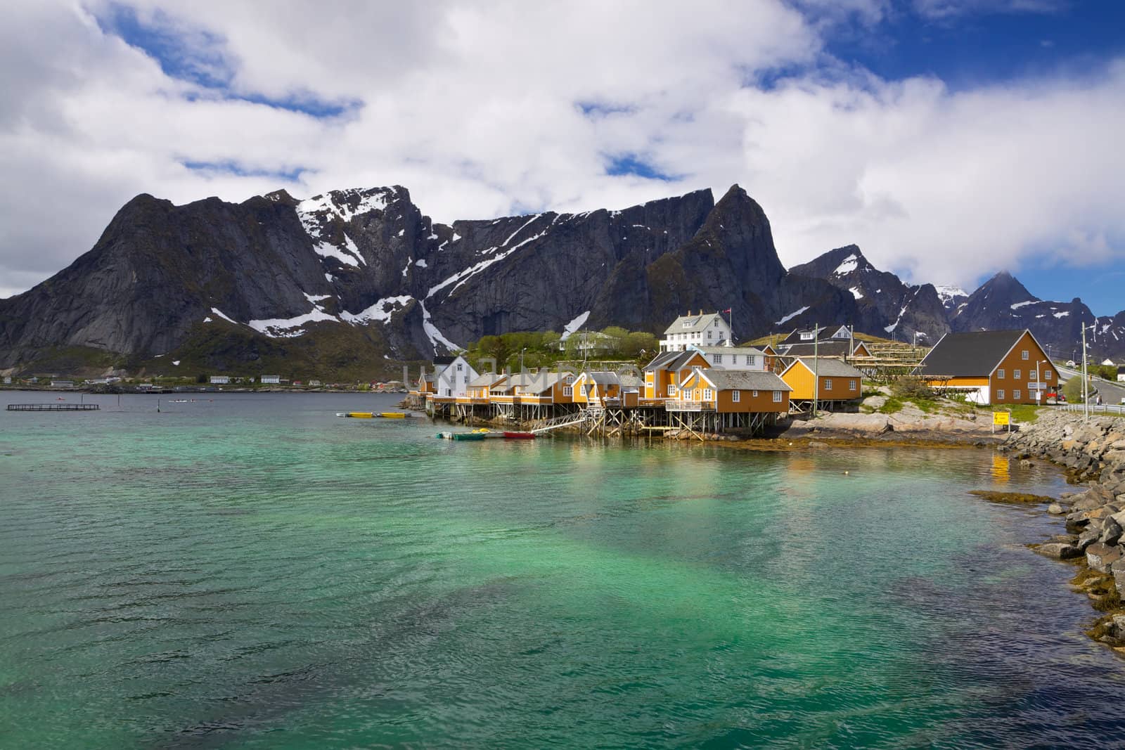 Traditional fishing village Sakrisoy on Lofoten islands in Norway with typical yellow buildings