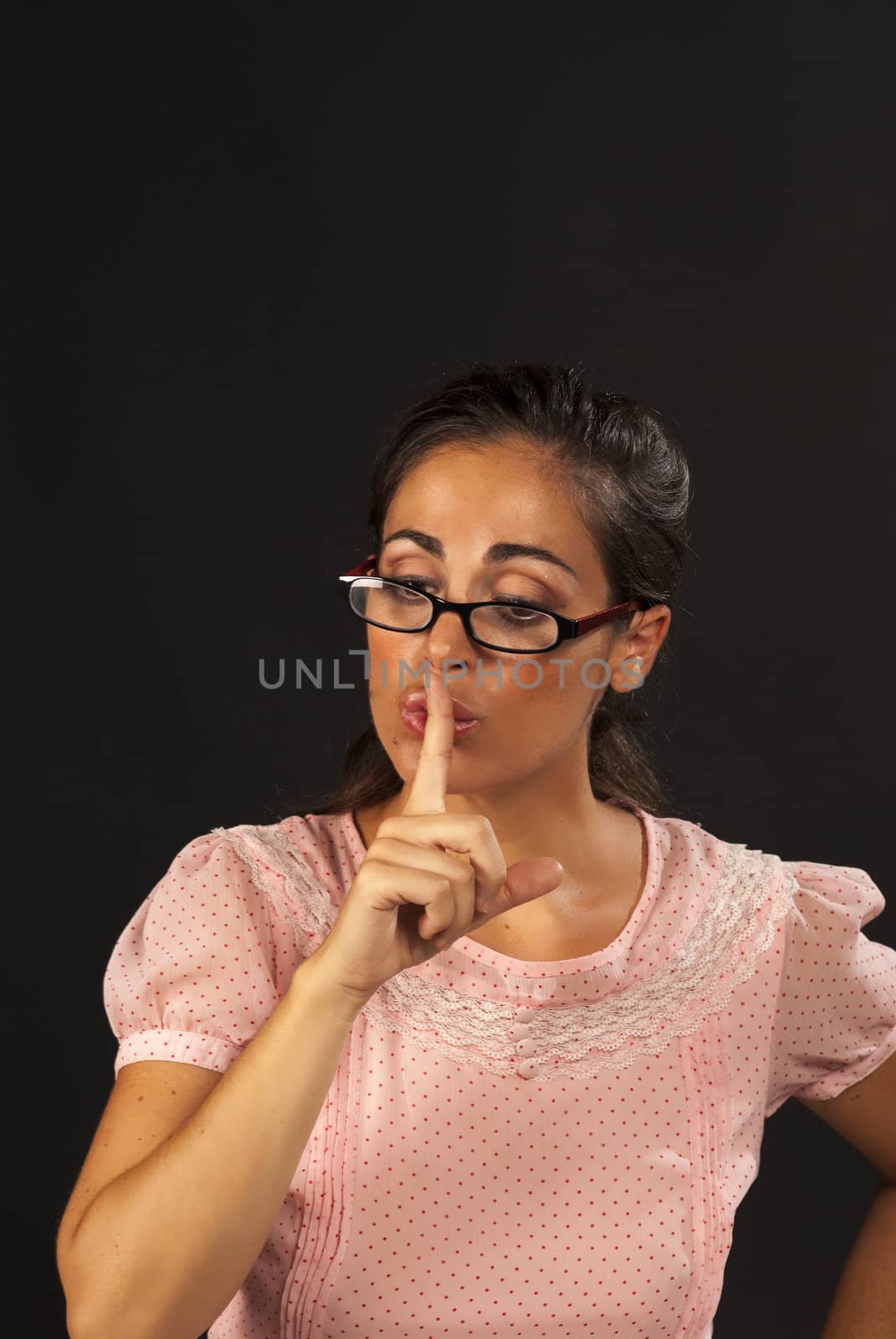 Severe woman in a teacher attitude requesting silence