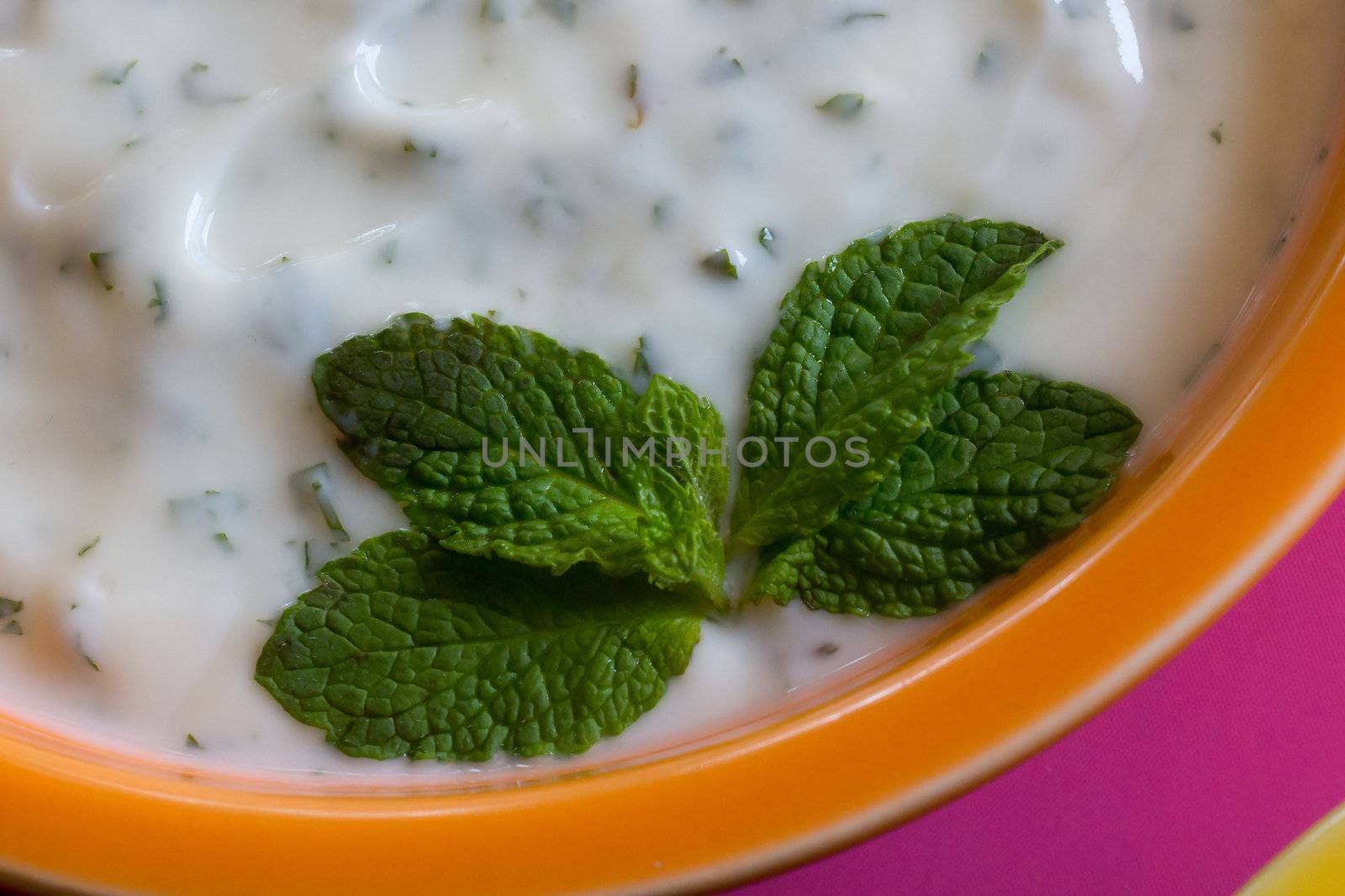 Fresh leaves of mint decorate the serving dish