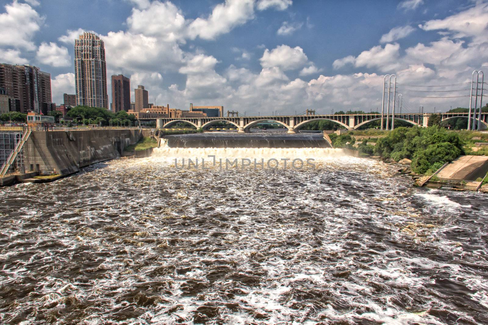 Water flows over the St. Anthony Dam in downtown Minneapolis, Minnesota