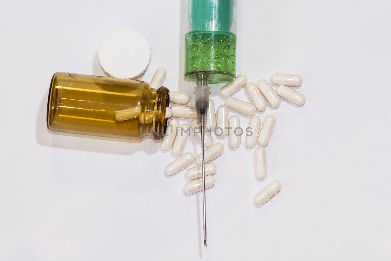 Pill box emptied out, with syringe by koep