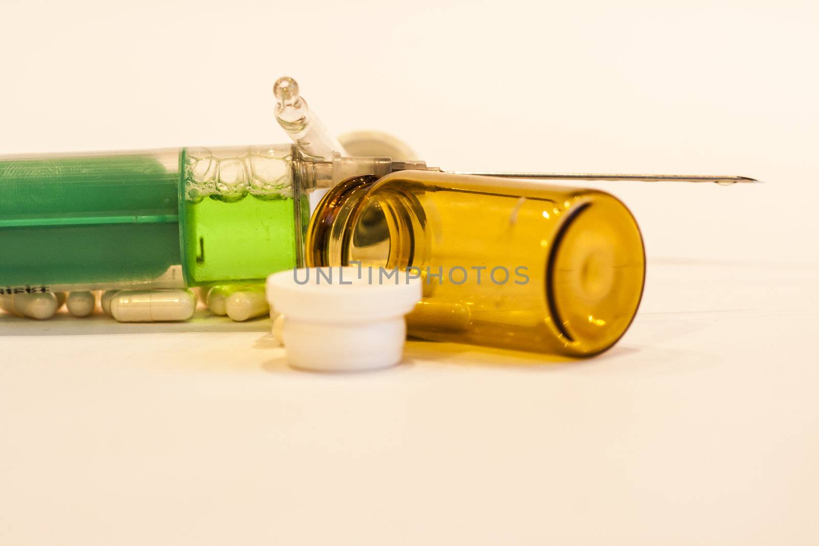 Pill box emptied out, with syringe by koep
