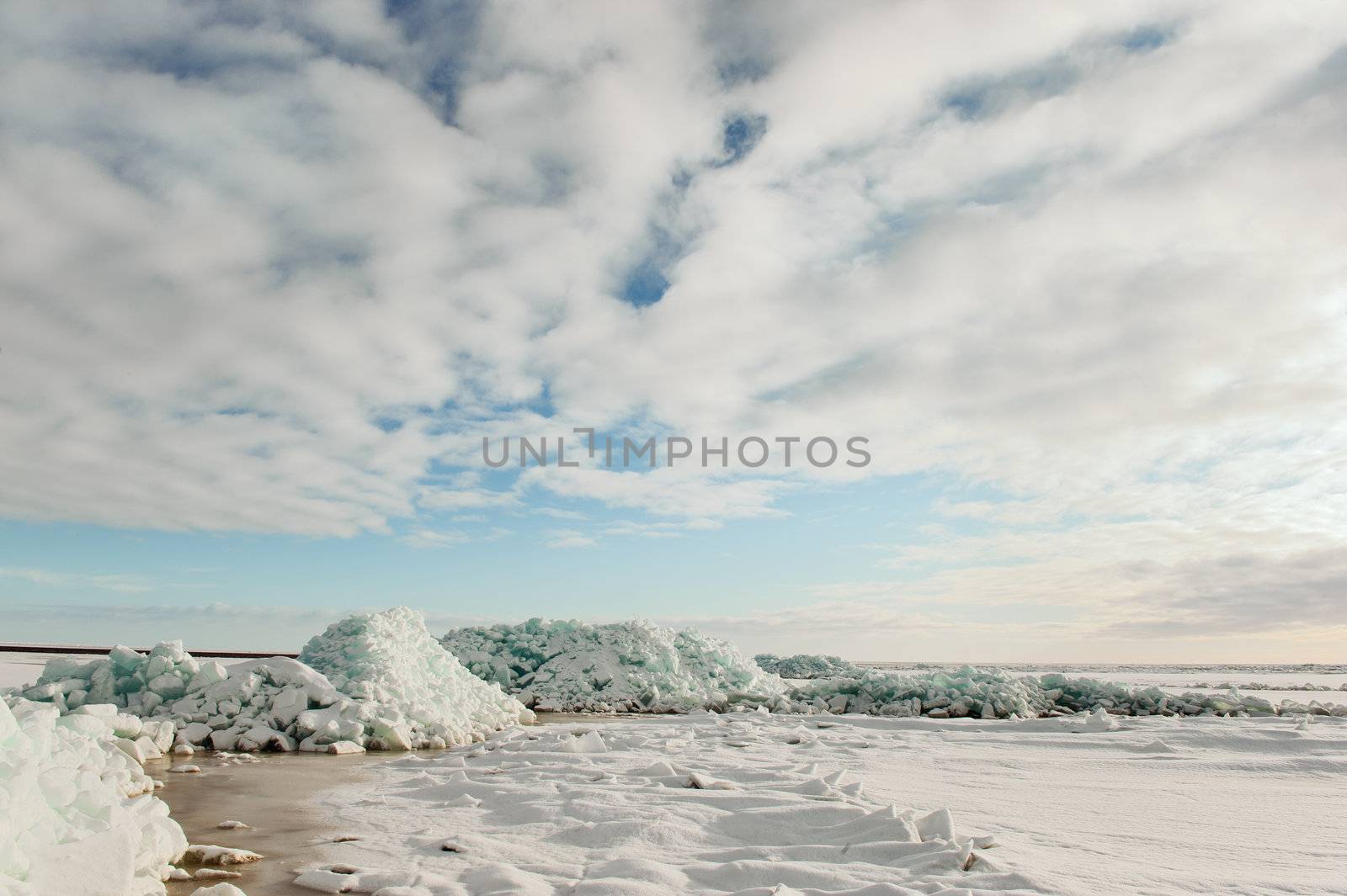 Winter Ladoga Lake. Ice, snow, clouds ... Russia