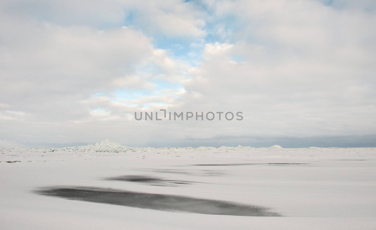 Winter Ladoga Lake. Ice, snow, clouds ... Russia