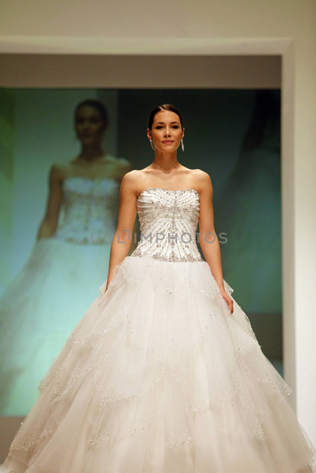 ZAGREB, CROATIA - FEBRUARY 19: Fashion model walks the runway in wedding dress on 'Wedding days' show, February 19, 2012 in Zagreb, Croatia.