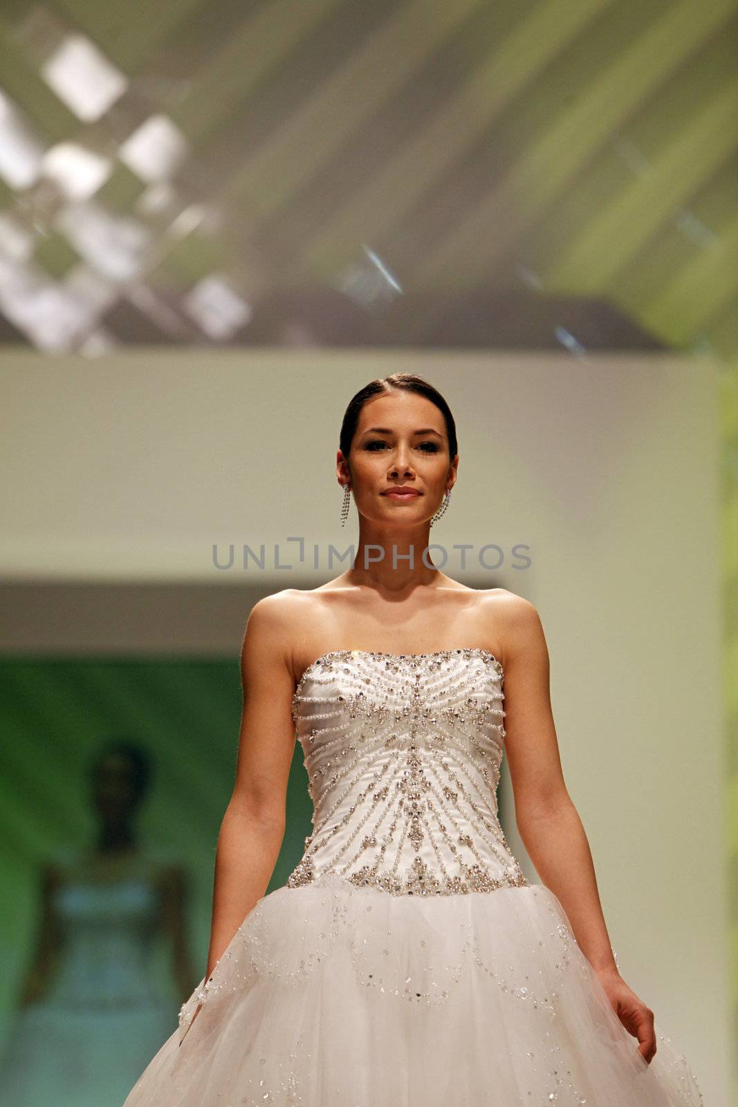 ZAGREB, CROATIA - FEBRUARY 19: Fashion model walks the runway in wedding dress on 'Wedding days' show, February 19, 2012 in Zagreb, Croatia.