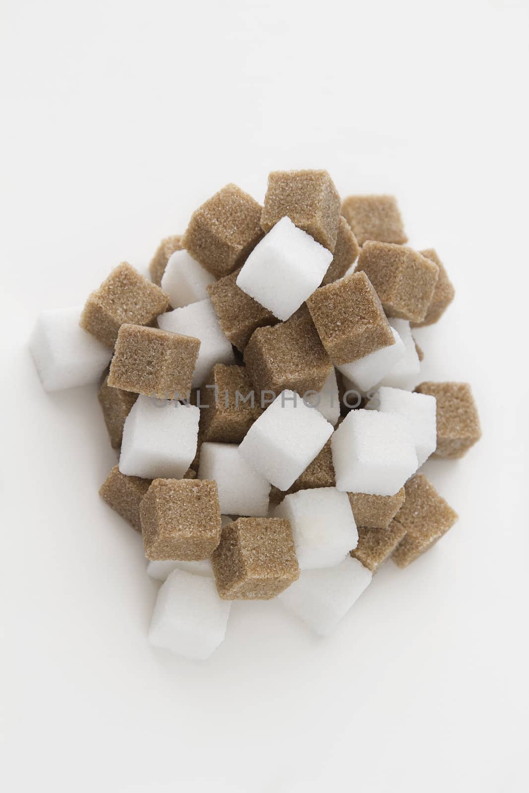 White and brown sugar cube pile in random fashion