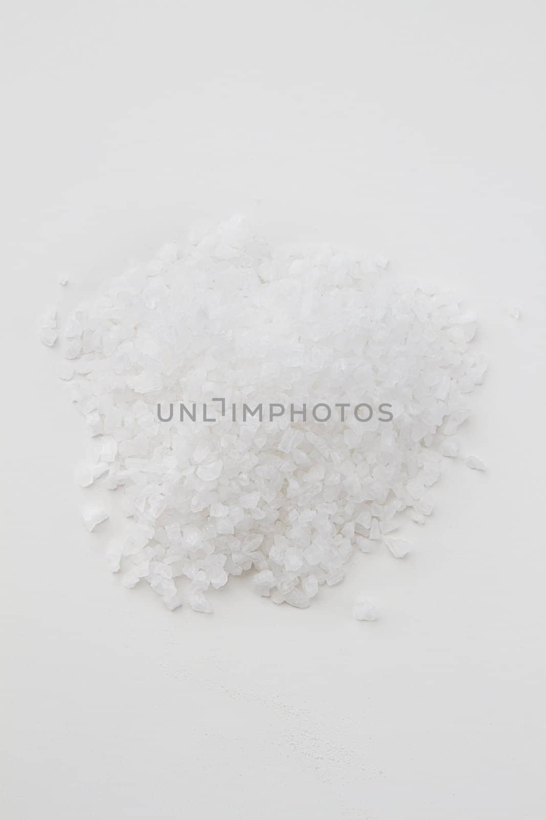 Pile of white salt against a white background