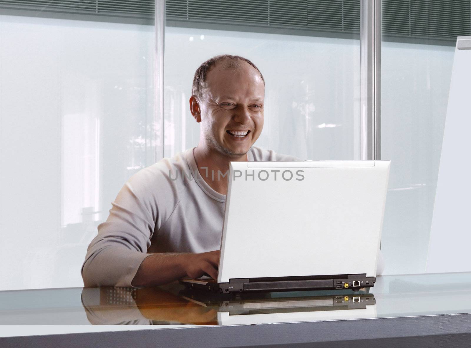 happy businessman in the office who working on the notebook