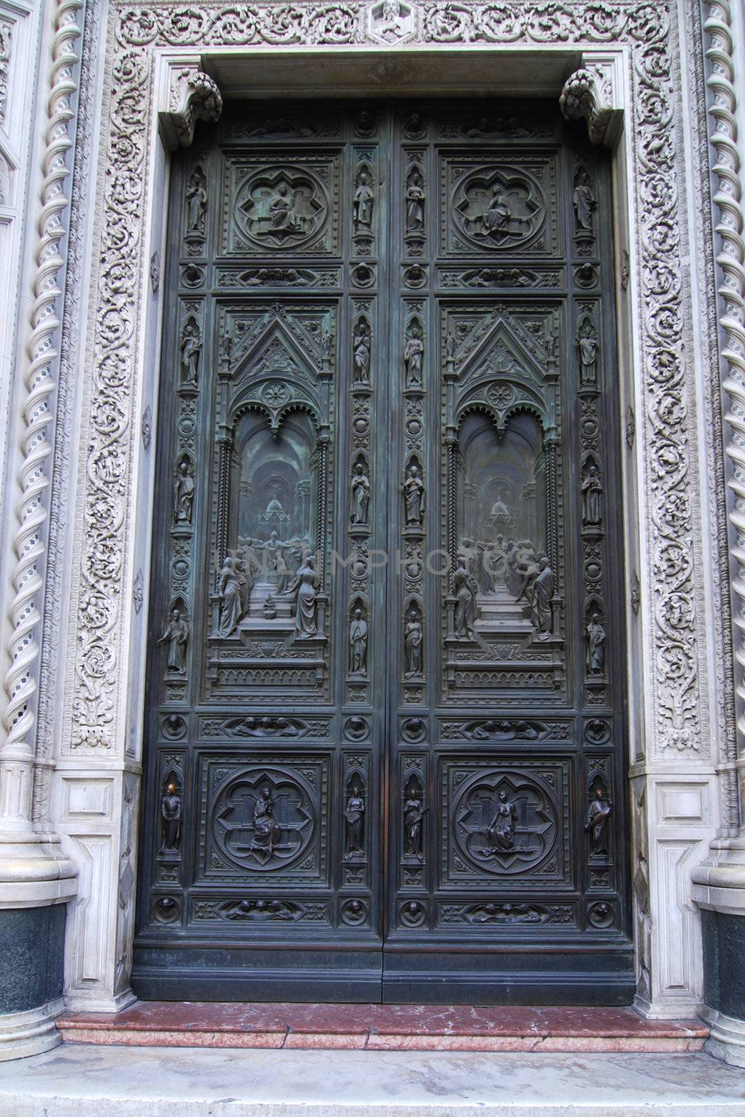 Beautiful renaissance bronze door of the cathedral Santa Maria del Fiore in Florence, Italy