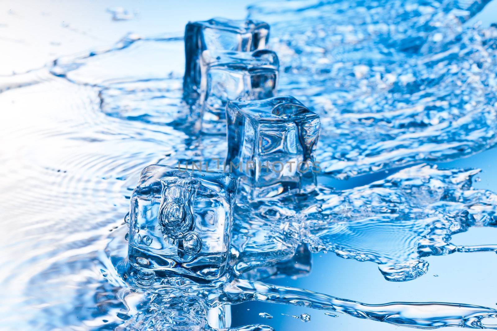 ice cube with pure water on reflective surface