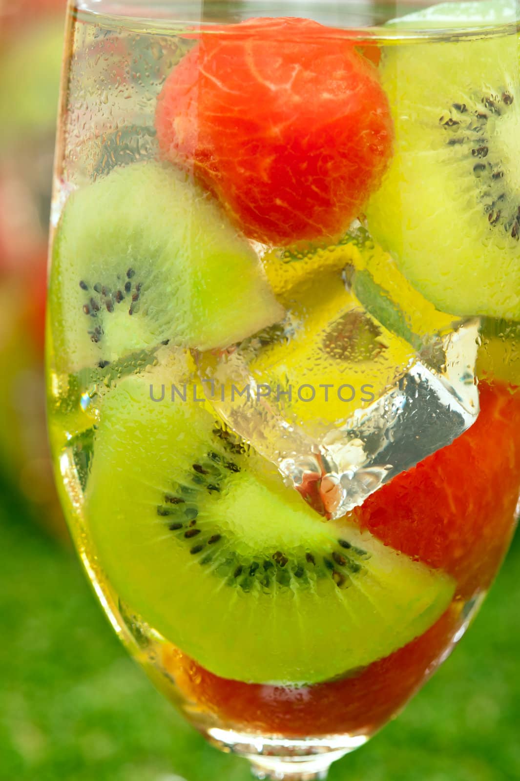 Kiwi Melon Sangria in front of timber wall