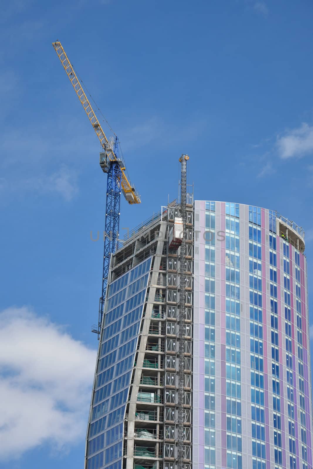 Modern High Rise Building with crane