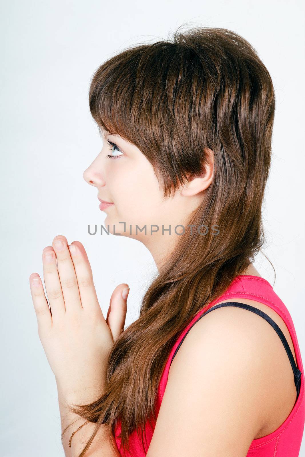 blue-eyed teen girl praying. profile by pzRomashka