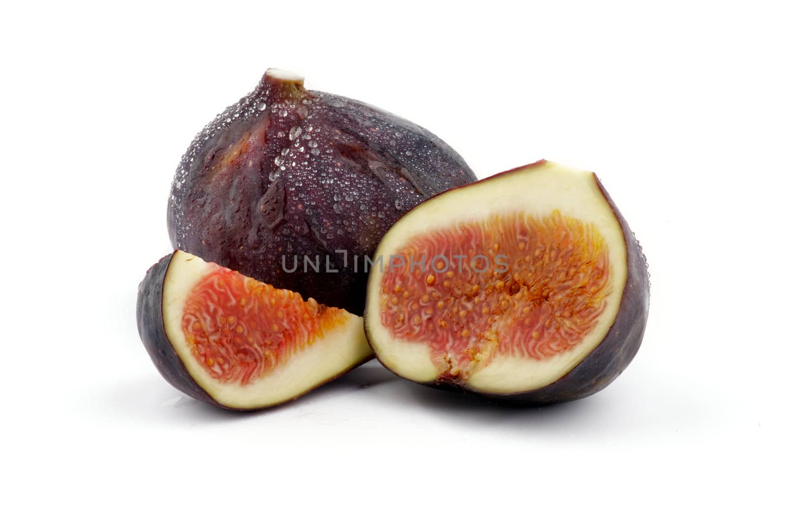 Two Perfect Ripe Figs full body and slices isolated on white background