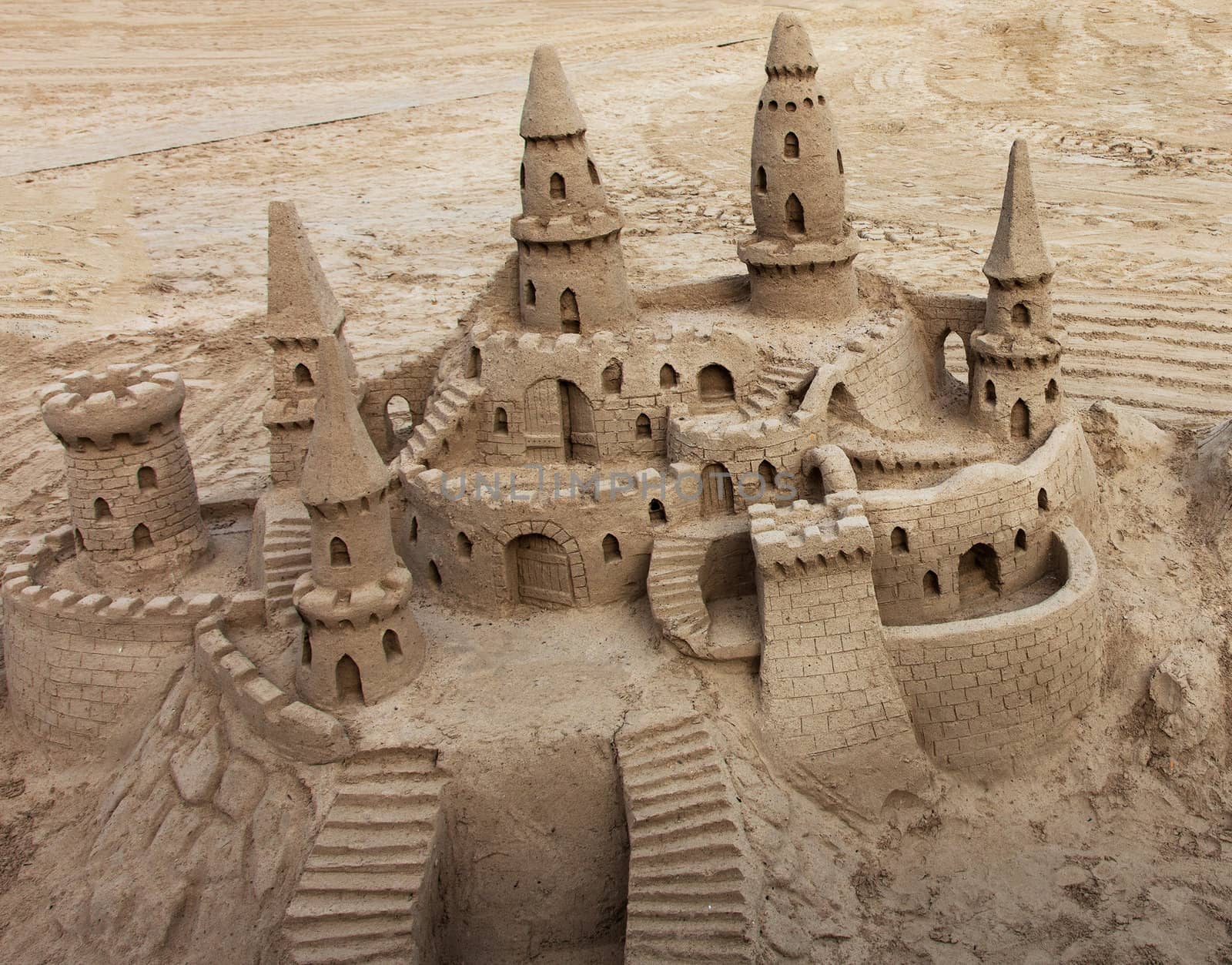 A beautiful sand castle on a beach.