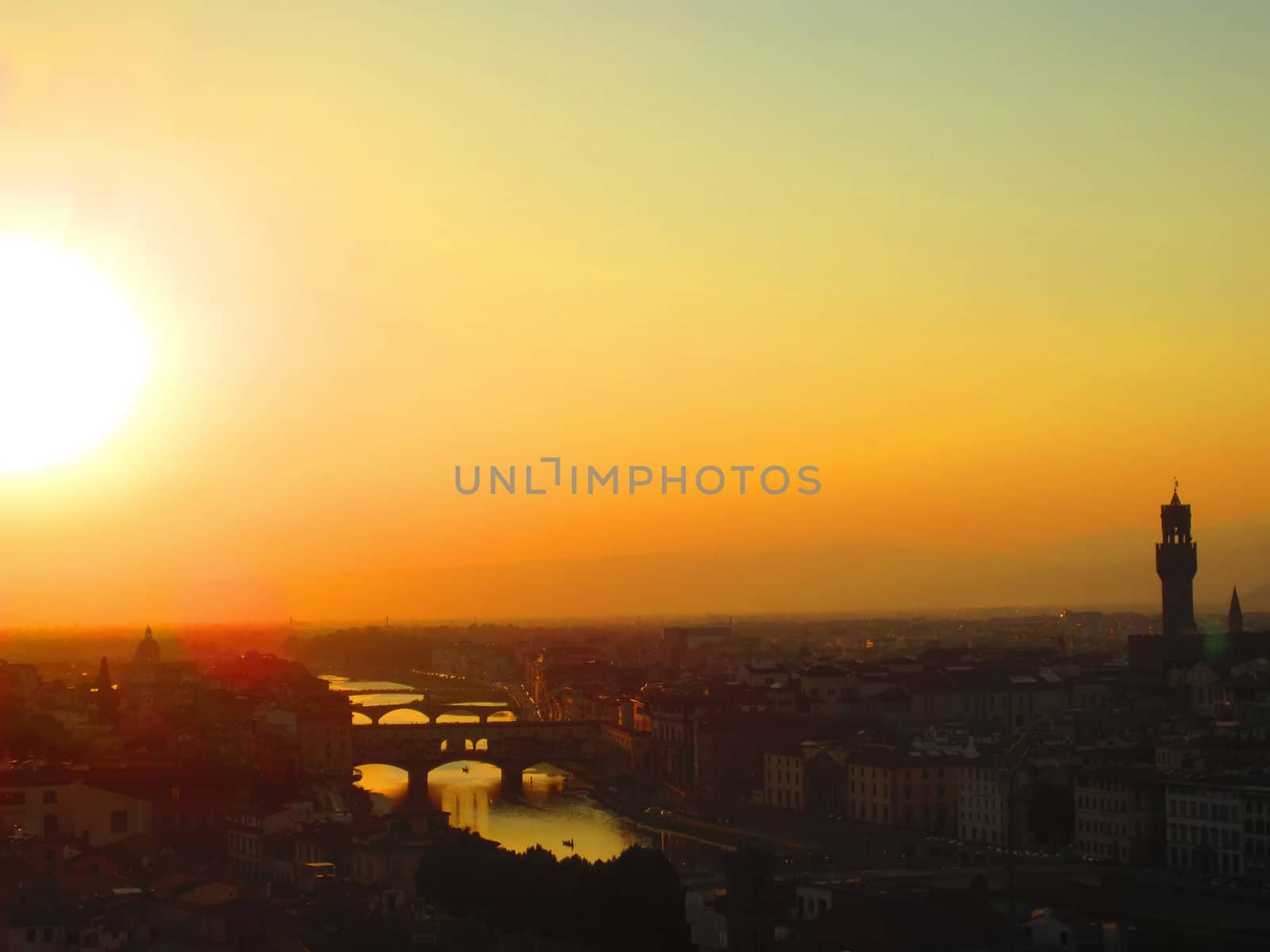 Sunset in Florence with river Arno and Ponte Vecchio                               