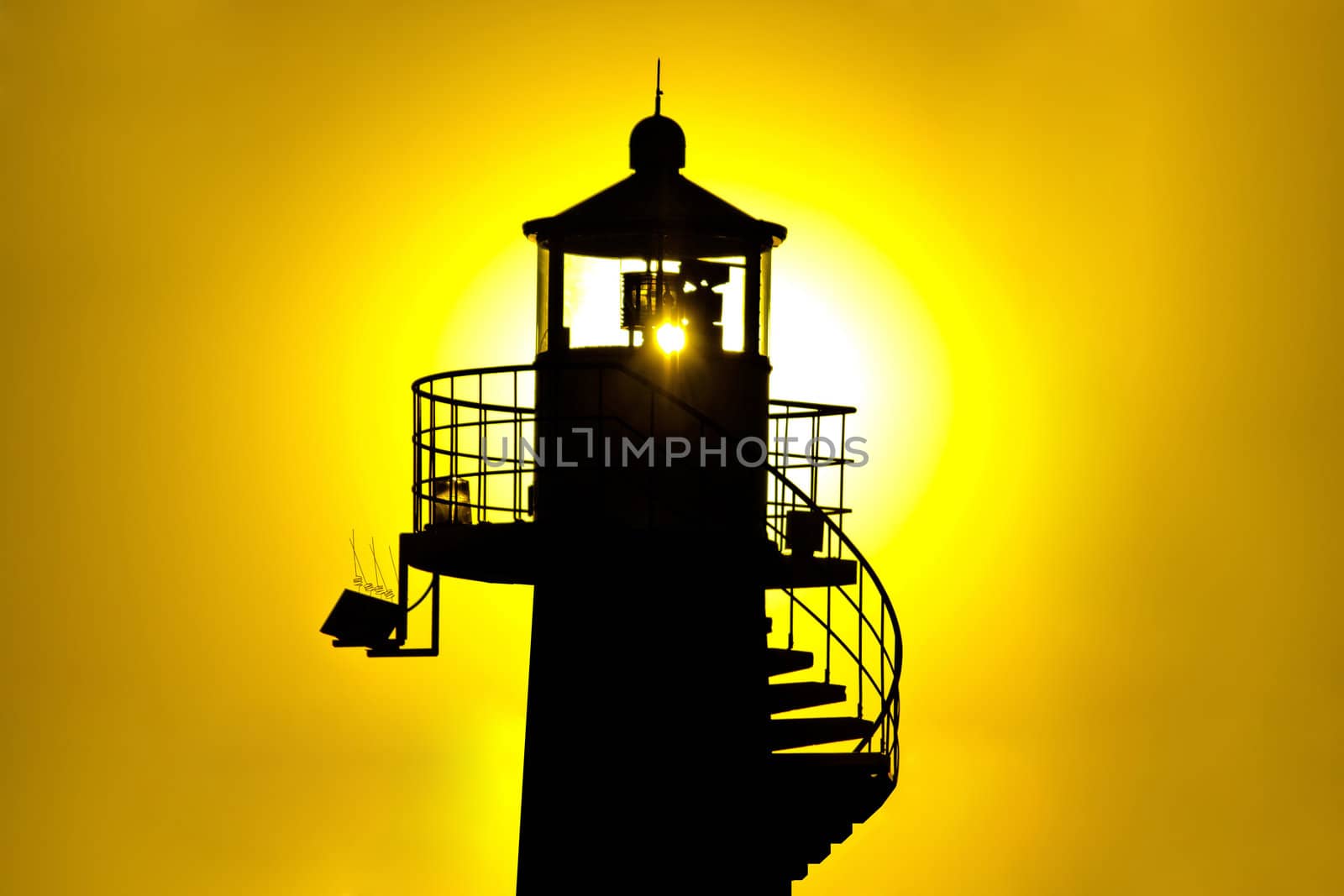 Lighthouse silhouetteat yellow sunset, Zadar, Croatia