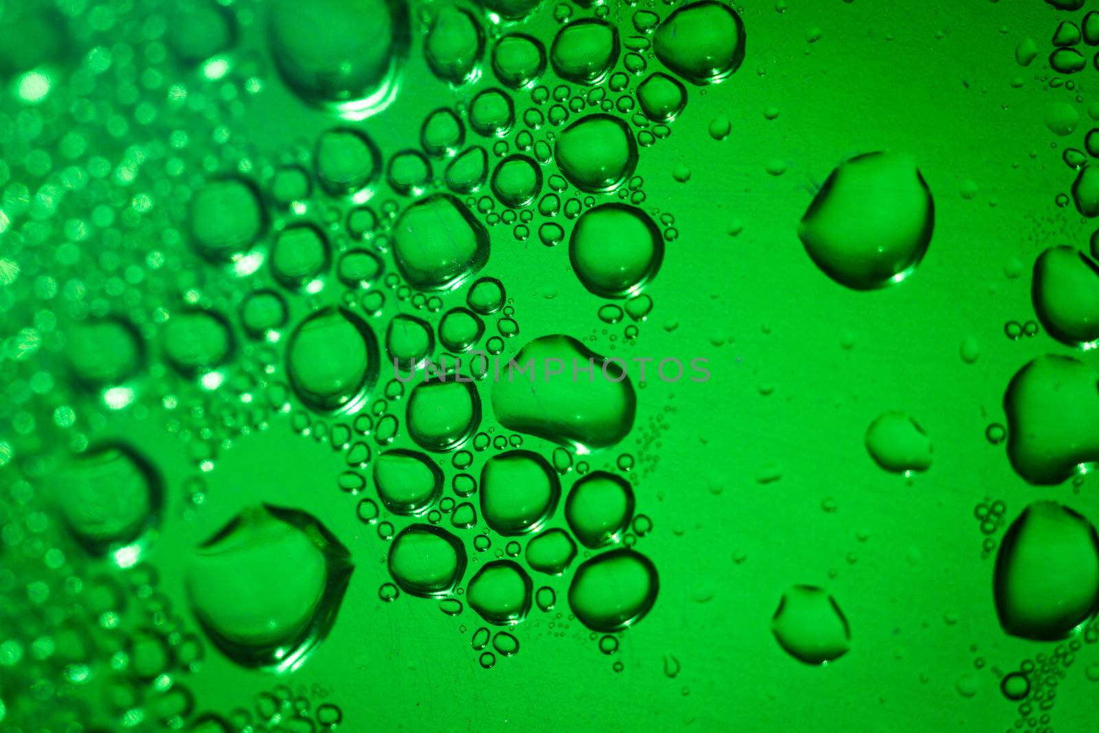 Refreshing green watery background (color toned image; shallow DOF)