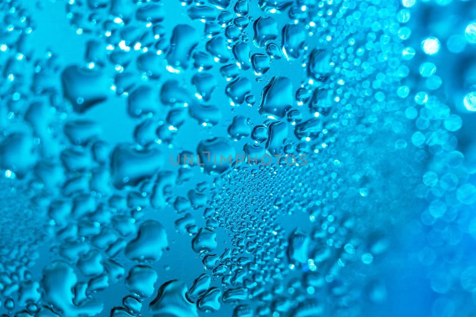 Refreshing blue watery background (color toned image; shallow DOF)