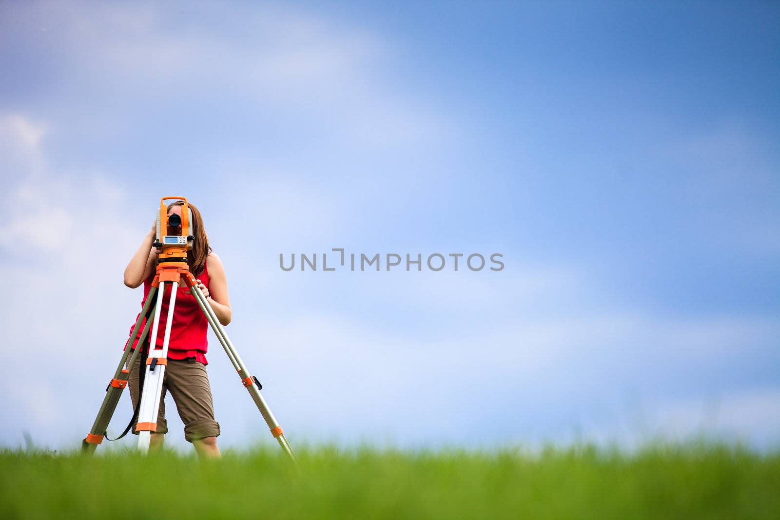 Young land surveyor at work