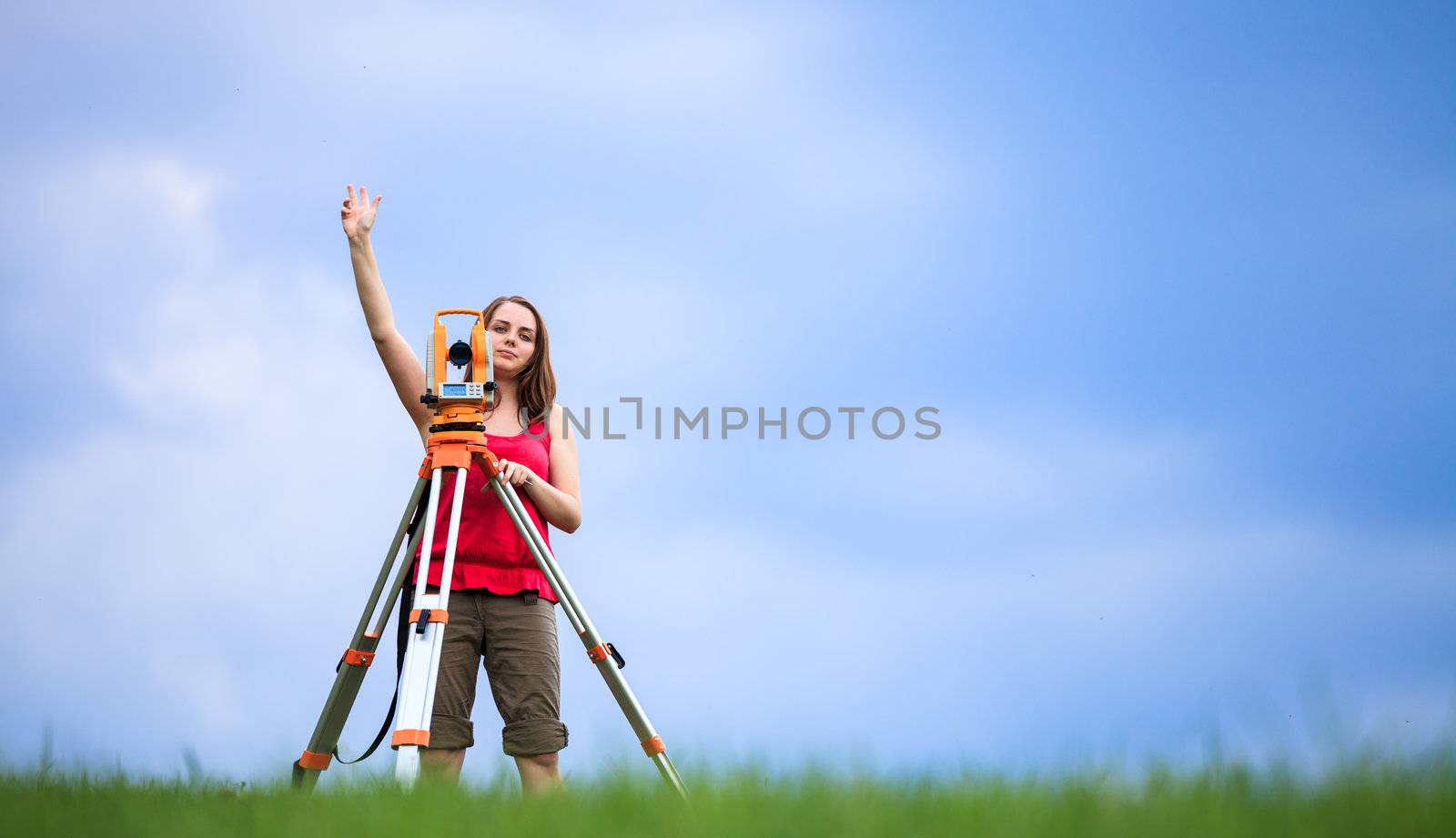 Young land surveyor at work