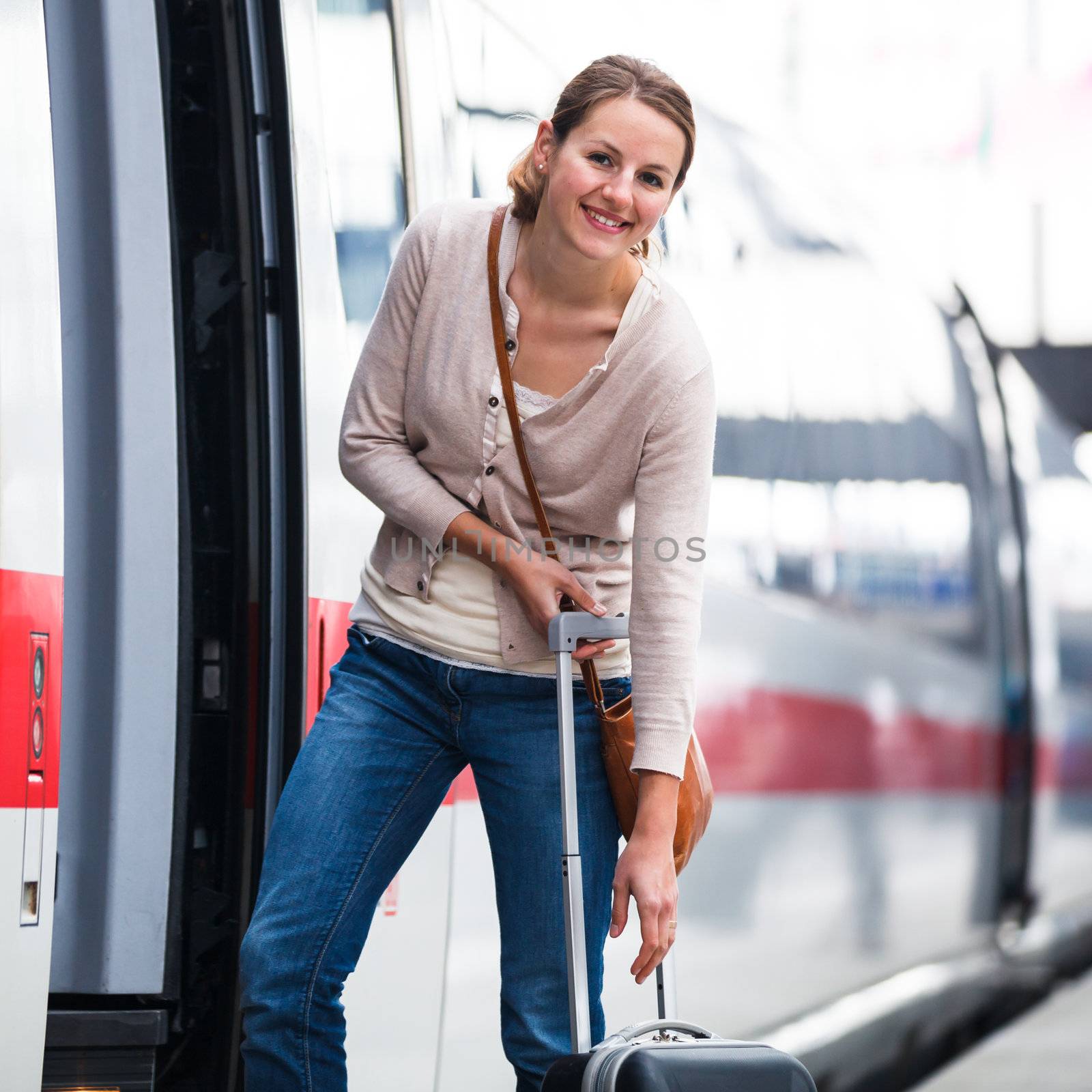 Pretty young woman boarding a train