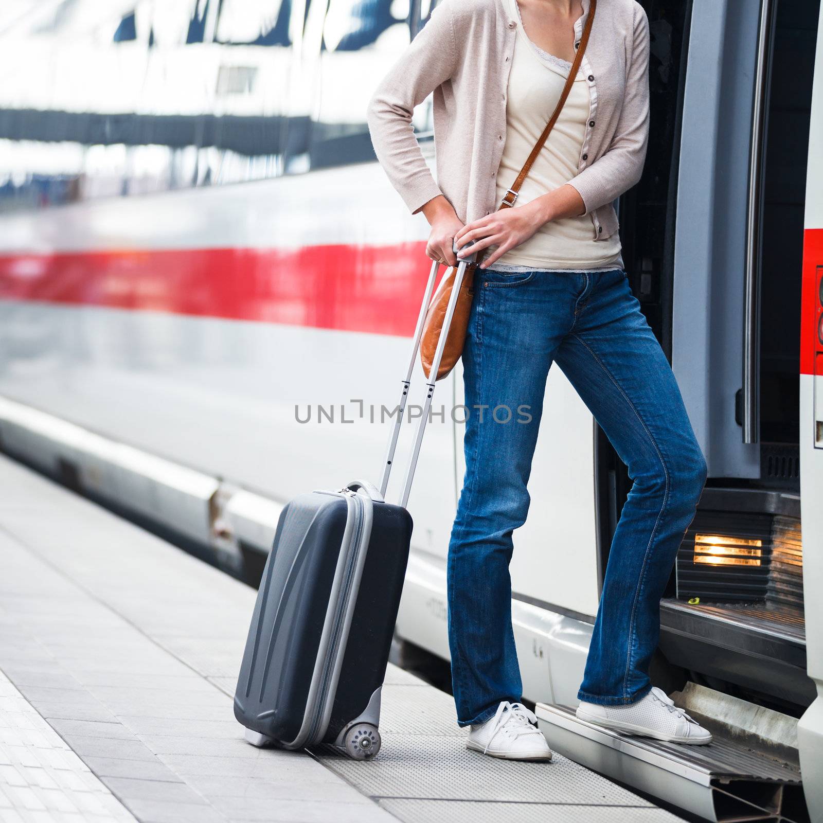 Pretty young woman boarding a train